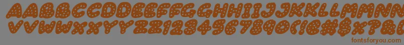 Шрифт Gingerbread Italic – коричневые шрифты на сером фоне