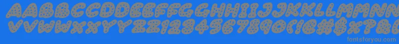 Fonte Gingerbread Italic – fontes cinzas em um fundo azul