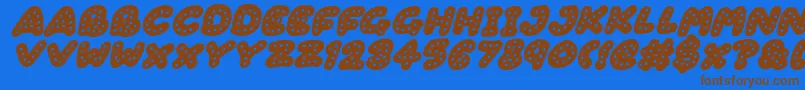 Fonte Gingerbread Italic – fontes marrons em um fundo azul