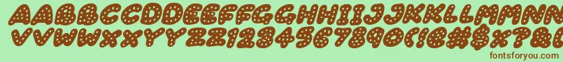 Gingerbread Italic-Schriftart – Braune Schriften auf grünem Hintergrund