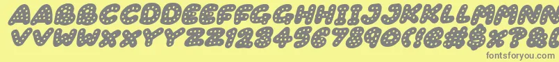 Gingerbread Italic-fontti – harmaat kirjasimet keltaisella taustalla
