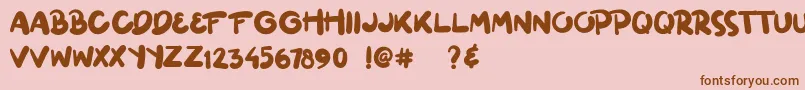 ginuks Font – Brown Fonts on Pink Background