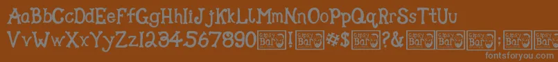 Więcej informacji o czcionce Gipsy Bar Czcionka Gipsy Bar – szare czcionki na brązowym tle