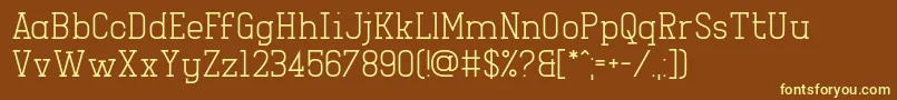 Girlesque-fontti – keltaiset fontit ruskealla taustalla