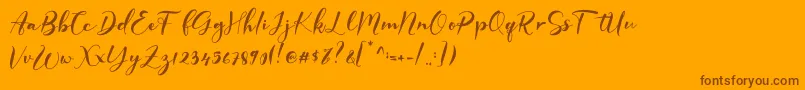 GISELLE-Schriftart – Braune Schriften auf orangefarbenem Hintergrund