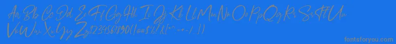 フォントGiugliamore Font – 青い背景に灰色の文字