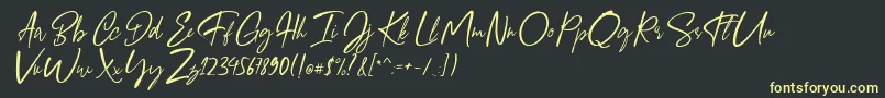 フォントGiugliamore Font – 黒い背景に黄色の文字