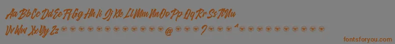 glarious-Schriftart – Braune Schriften auf grauem Hintergrund