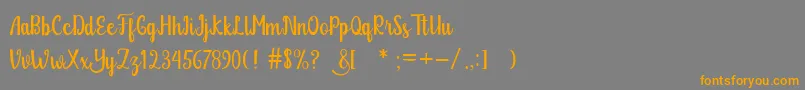 Glitter Free Font – Orange Fonts on Gray Background