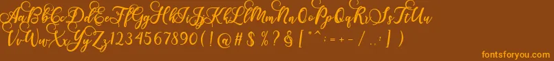 Gloretha Script-fontti – oranssit fontit ruskealla taustalla