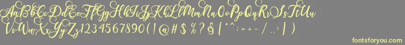 Fonte Gloretha Script – fontes amarelas em um fundo cinza