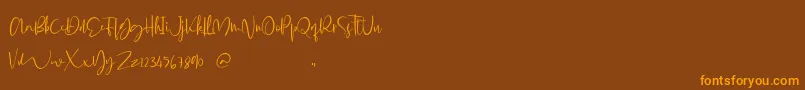 Glorial Font – Orange Fonts on Brown Background