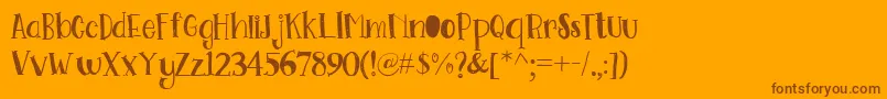 Go Doodling Font-fontti – ruskeat fontit oranssilla taustalla