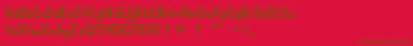 Go Frog-Schriftart – Braune Schriften auf rotem Hintergrund