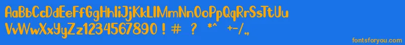 フォントGo Frog – オレンジ色の文字が青い背景にあります。