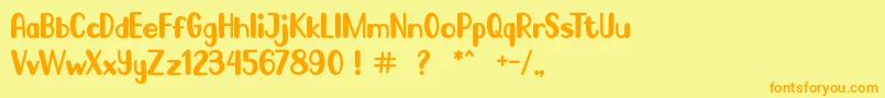 フォントGo Frog – オレンジの文字が黄色の背景にあります。