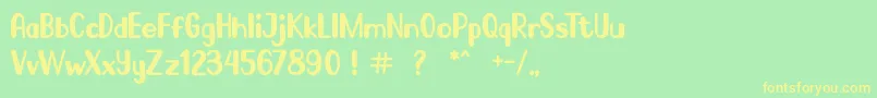 フォントGo Frog – 黄色の文字が緑の背景にあります