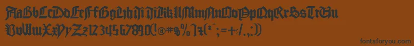 フォントgocmp    – 黒い文字が茶色の背景にあります