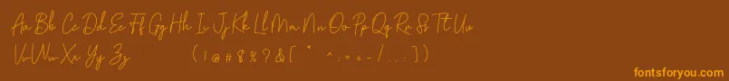 Golden Bridge Script Font – Orange Fonts on Brown Background