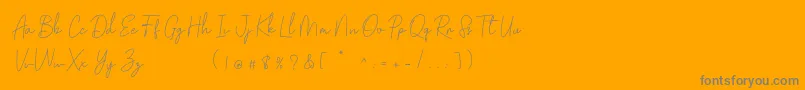 Golden Bridge Script-Schriftart – Graue Schriften auf orangefarbenem Hintergrund