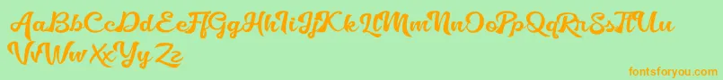 フォントGolliath – オレンジの文字が緑の背景にあります。