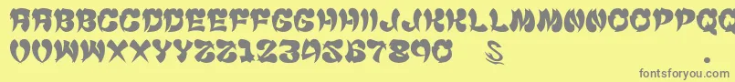 gomarice cyankonabe-Schriftart – Graue Schriften auf gelbem Hintergrund
