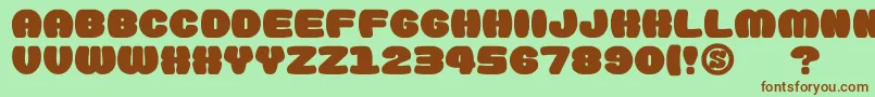 gomarice doughnut monster-Schriftart – Braune Schriften auf grünem Hintergrund