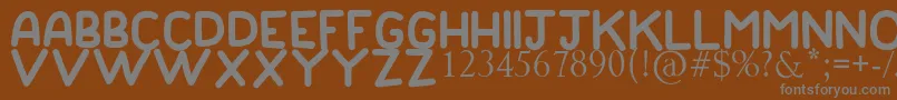 GOOD DADDYフォントについての詳細 フォントGOOD DADDY – 茶色の背景に灰色の文字