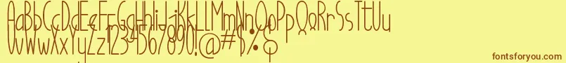 フォントGood Egg Dafont – 茶色の文字が黄色の背景にあります。