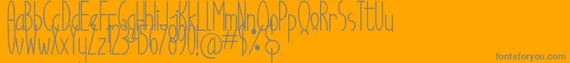 Good Egg Dafont-Schriftart – Graue Schriften auf orangefarbenem Hintergrund