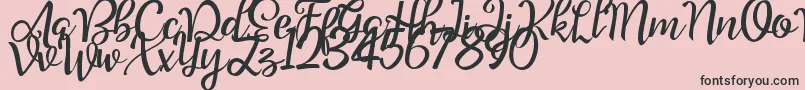Шрифт Good Feeling Script Demo – чёрные шрифты на розовом фоне