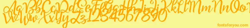 フォントGood Feeling Script Demo – オレンジの文字が黄色の背景にあります。