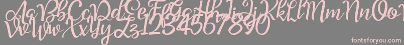 Шрифт Good Feeling Script Demo – розовые шрифты на сером фоне