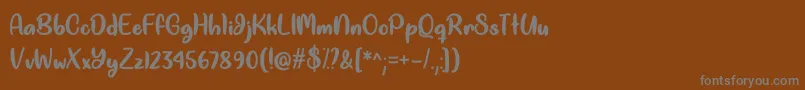 フォントGood Unicorn   – 茶色の背景に灰色の文字