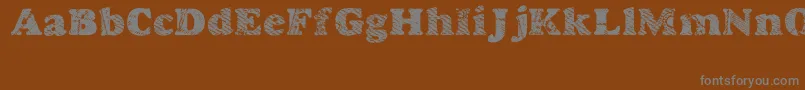 Шрифт Goodjean – серые шрифты на коричневом фоне