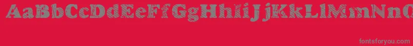 Goodjean-fontti – harmaat kirjasimet punaisella taustalla
