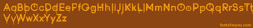 Goofont demo Font – Orange Fonts on Brown Background