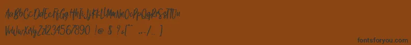 Шрифт Gook Kitt   Personal Use – чёрные шрифты на коричневом фоне