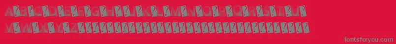 フォントGotFaded – 赤い背景に灰色の文字