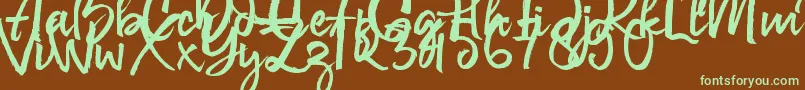 フォントGovani Emir – 緑色の文字が茶色の背景にあります。