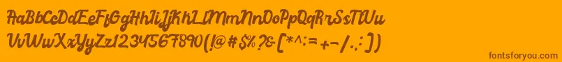 graduation-Schriftart – Braune Schriften auf orangefarbenem Hintergrund