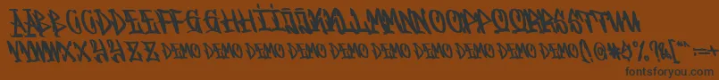 Graffitasi Demo-Schriftart – Schwarze Schriften auf braunem Hintergrund