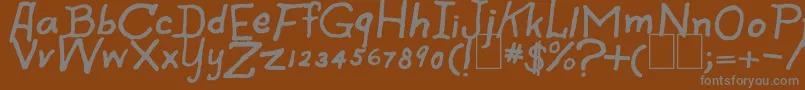 SpookySpiders-fontti – harmaat kirjasimet ruskealla taustalla