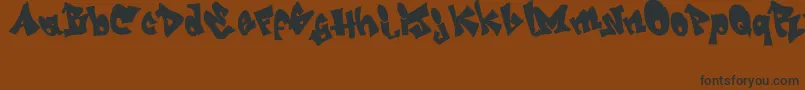 GRAFITI   jedagraphicx-Schriftart – Schwarze Schriften auf braunem Hintergrund