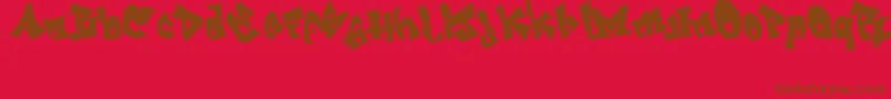 Fonte GRAFITI   jedagraphicx – fontes marrons em um fundo vermelho