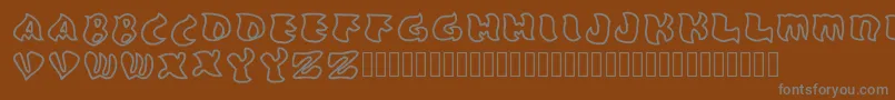 フォントGrafooutline Regular – 茶色の背景に灰色の文字