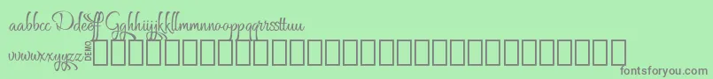 フォントGrafyk Demo – 緑の背景に灰色の文字