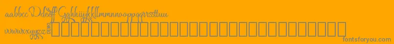 フォントGrafyk Demo – オレンジの背景に灰色の文字