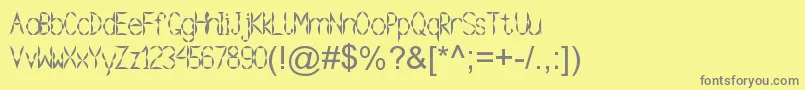 フォントGramoclericton – 黄色の背景に灰色の文字