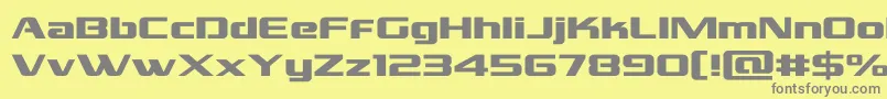 フォントgrandnationalexpand – 黄色の背景に灰色の文字